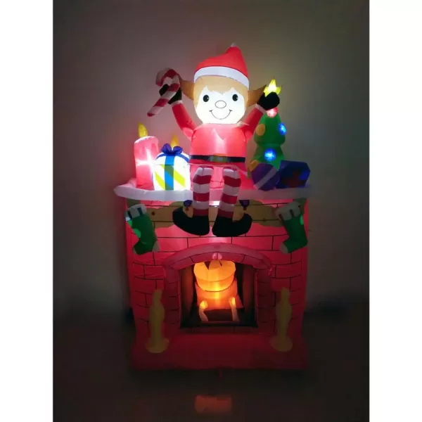 Fraser Hill Farm 6.5 ft. Pre-Lit Elf Sitting on a Fireplace Christmas Inflatable